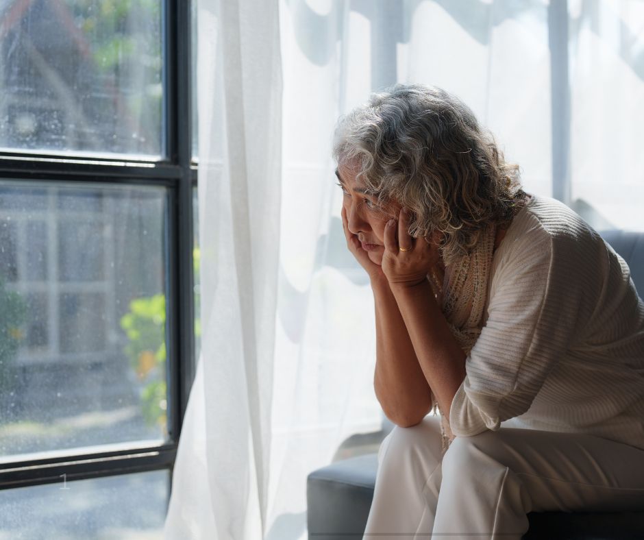 woman looking out of window